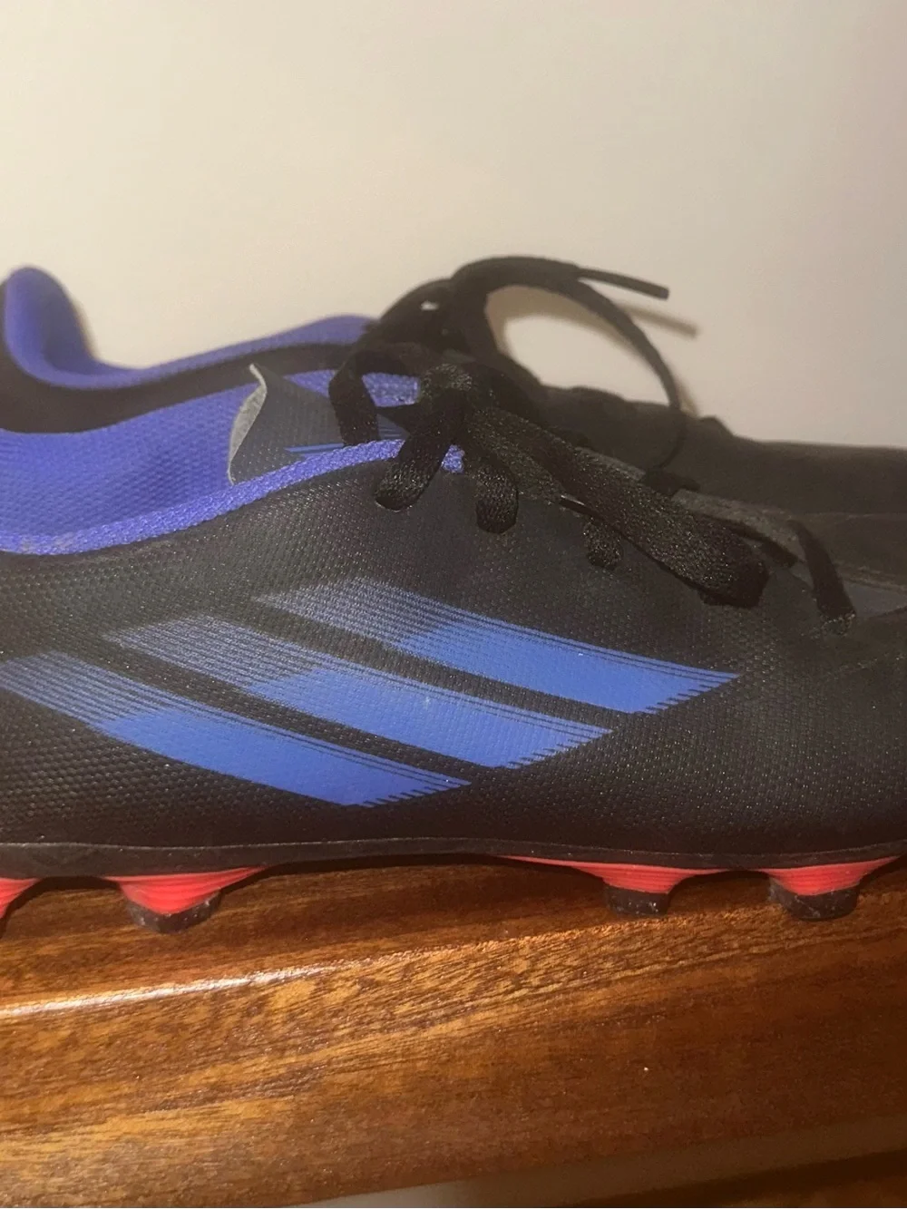 adidas Black Cleats with Blue Accents and Red Studs